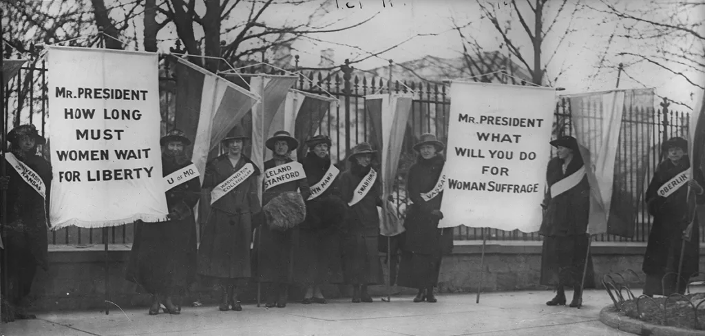 Women suffragists picketing in front of the White house